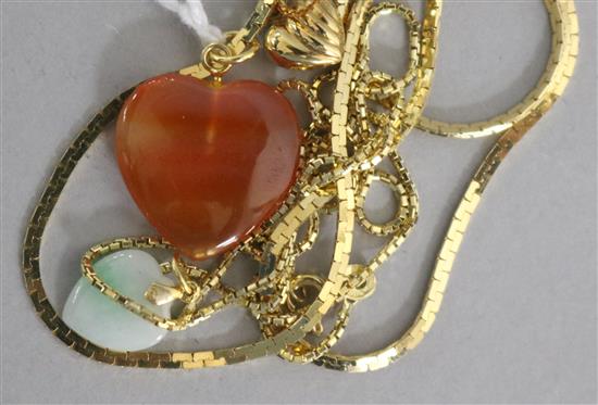 A heart-shaped hardstone pendant, a similar jade pendant, a similar 18ct gold pendant and a 14ct gold chain,